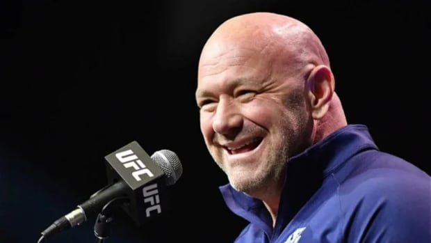 UFC CEO Dana White has a laugh with reporters during a press conference.